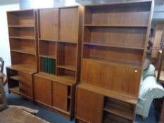 A mid century three section teak wall cabinet