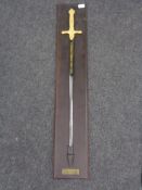 A large ornamental sword on wooden board - Cermonial Epee