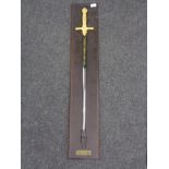 A large ornamental sword on wooden board - Cermonial Epee