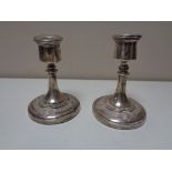 A pair of silver squat candlesticks in celtic design CONDITION REPORT: Small knock