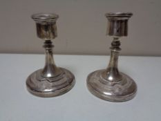 A pair of silver squat candlesticks in celtic design CONDITION REPORT: Small knock