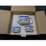 A Wade blue and white teapot, sugar basin and cream jug, in retail box.