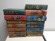 Fifteen early twentieth century illustrated children's adventure books including five first