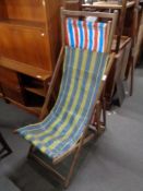 Two vintage wooden folding deck chairs