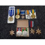 Three WW I medals together with WW II medals and others.