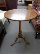 An antique style oak occasional table