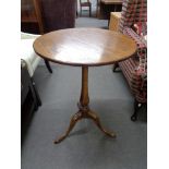 An antique style oak occasional table