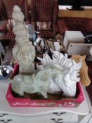 A box of decorative horse figures,