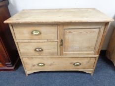 A Victorian stripped pine cabinet