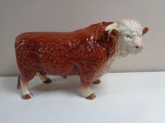 A large china model of a Hereford bull by Melba