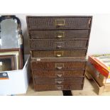 A set of two banks of four office storage drawers