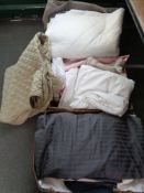 Three crates of bedding, throws,