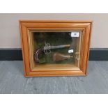A montage in glazed box frame : Ornamental flintlock pistol with brass and copper powder flask,