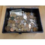 A plastic box containing a quantity of penny pieces, copper and other UK coins.