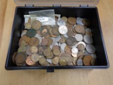 A plastic box containing a quantity of penny pieces, copper and other UK coins.