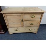A Victorian stripped pine cabinet with three drawers