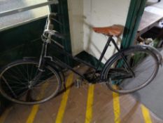 A vintage bicycle with leather saddle