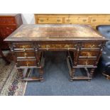 A late nineteenth century oak pedestal desk stamped Hobbs and Co, London.