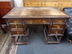 A late nineteenth century oak pedestal desk stamped Hobbs and Co, London.