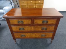 A late nineteenth century walnut four drawer chest