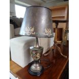 A contemporary table lamp in antique style with metal shade