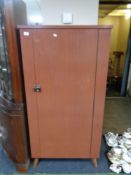 A Formica veneered storage cupboard