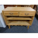 A light oak side table fitted with two drawers