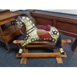 A mid century painted wooden rocking horse by Collinson CONDITION REPORT: 122cm
