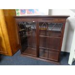 A reproduction mahogany bookcase