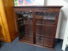 A reproduction mahogany bookcase