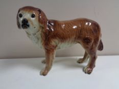 A nineteenth century pottery figure of a spaniel