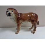 A nineteenth century pottery figure of a spaniel