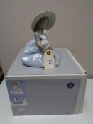 A Lladro figure - Bunny Kisses, 06741, boxed.