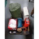 A box of sleeping bag, security floodlight, bench grinder,