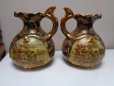 A pair of Oriental style gilded ewers (2)