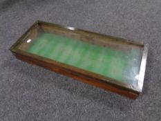 A stained pine glazed wall display case