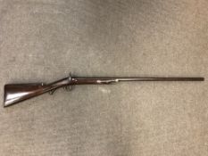 A 19th century single barreled percussion cap sporting gun, walnut stock, scroll trigger guard,