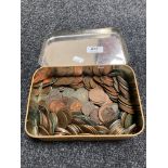 A vintage tin of coins,