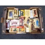 A crate of die cast model vehicles etc