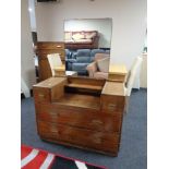 An early twentieth century linen cabinet with matching dressing table