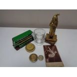 A box of antique brass figure - Scrooge, scale weights, Dinky toys bus, glass egg cup,