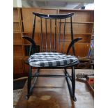 A mid century Continental-style rocking chair.