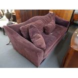 A large settee with cushion in purple fabric by Kelly Hoppen CONDITION REPORT: