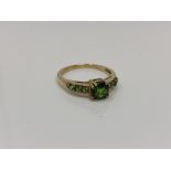 A 9ct gold green diopside ring, size O CONDITION REPORT: 2.