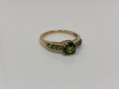 A 9ct gold green diopside ring, size O CONDITION REPORT: 2.