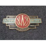 An early 20th century brass hand painted sign 'J.W.S.
