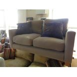 A contemporary two seater settee with scatter cushions