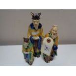 Three twentieth century glazed pottery figures of Chinese elders