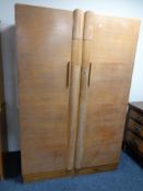 An early twentieth century oak double door wardrobe CONDITION REPORT: Locked and