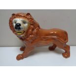 Three nineteenth century Staffordshire lion figures